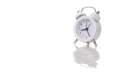 Wall Mural - White alarm clock on white background