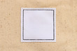 blank white leather label on brown canvas fabric background
