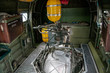 B-24 Liberator interior view of Ball Turret mount with yellow oxygen tanks and ammo cans.