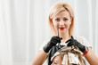 © Denys Kurbatov - Attractive hairdresser dyeing hair of female client while she sitting in chair