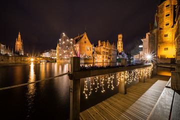 Wall Mural - Perez de Malvenda house and Belfry of Bruges during the Christmas period