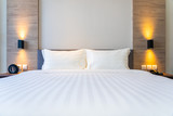 Fototapeta Na drzwi - White comfortable pillow on bed decoration interior