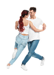 Wall Mural - Beautiful young couple dancing on white background