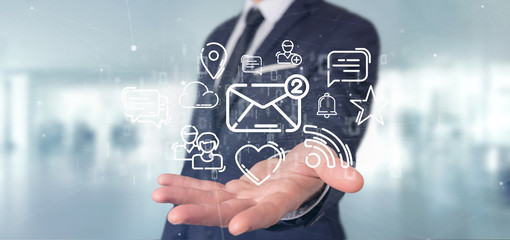 Businessman holding a cloud of social media network icon