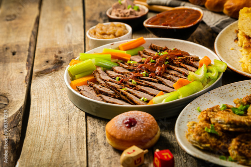 Selection Of Traditional Hanukkah Food For Festive Dinner Potato Latkes Applesauce Challah Beef Brisket Sufganiot Noodle Kugel Julienned Vegetables Buy This Stock Photo And Explore Similar Images At Adobe Stock