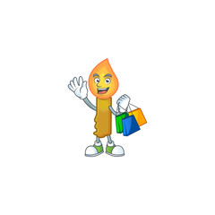 Wall Mural - Cheerful gold candle cartoon character waving and holding Shopping bags