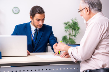 Financial advisor giving retirement advice to old man