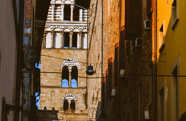 Wall Mural - Pistoia Tuscany Italy San Zeno cathedral bell tower view from typical narrow streets in town