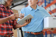 © chayathon2000 - Asian man delivery good box to customer in factory and signature on tablet smile and good service , logistic shopping online concept