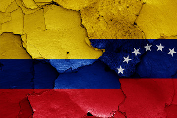 Wall Mural - flags of Colombia and Venezuela painted on cracked wall