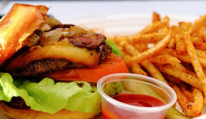 Wall Mural - Gourmet Cheeseburger with French Fries and Ketchup