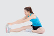 © NT_studio - Beautiful portrait young asian woman fitness with stretching leg isolated on white background, asia girl workout with full body exercise and warm up, body care and healthy concept.