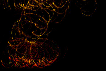 Wall Mural - Fantasy christmas background. diffused swirling lights on a black background