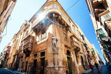 Historical sculptures and facades of ancient Valletta city center. Malta.