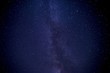 Leinwandbild Motiv Low angle shot of a galaxy sky filled with stars at night time