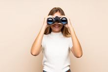 Young Blonde Woman Over Isolated Background With Black Binoculars