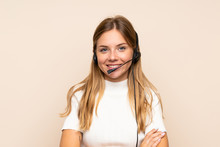 Young Blonde Woman Over Isolated Background Working With Headset