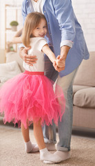 Wall Mural - Daddy teaching little girl dancing at home