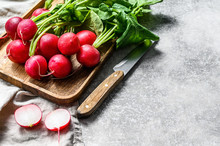 Fresh Red Radishes In A Wooden Bowl. Farm Organic Vegetables. Gray Background. Top View. Space For Text
