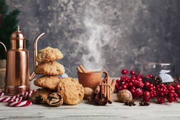 Wall Mural - Christmas treat with hot coffee cookies and candies. Festive card new year decoration on wooden board in rustic style.