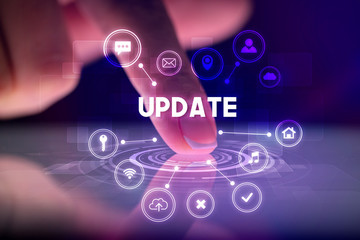 Finger touching tablet with web technology icons and UPDATE inscription, web technology concept