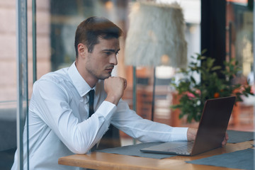 Poster - businessman sitting in cafe