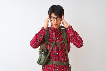 Wall Mural - Chinese hiker man wearing backpack canteen glasses over isolated white background with hand on head for pain in head because stress. Suffering migraine.