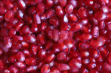 Pomegranate seeds on a background