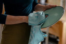 Woman Drying Plate With Dish Towel, Close-up
