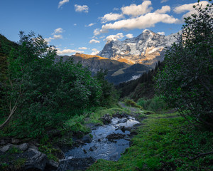 Wall Mural - Staubbach with Eiger, Mönch, and Jungfrau in the Evening Light,  Switzerland