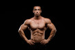 © kiy_lg - Sexy torso. Muscular model sports young man in jeans showing his press on a black background. Fashion portrait of sporty healthy strong muscle guy.
