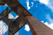 © Cavan Images - Detail of a modern glass mirror business building by London Bridge