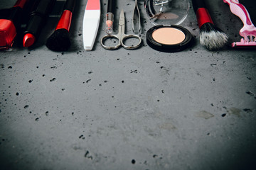 Canvas Print - A set of cosmetics on a dark stone background. The concept of doing makeup, caring for the appearance of women. Applying brushes, eye shadows, powder.