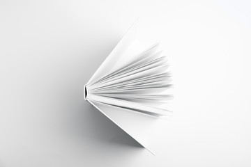 Open book with hard cover on white background, top view