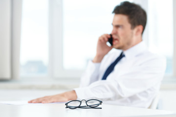 Poster - businessman talking on phone in office