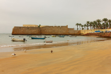 Wall Mural - Cadiz sea beach with fishing boats, Spain