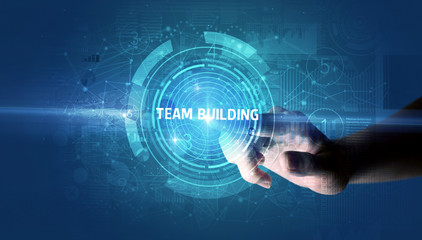 Hand touching TEAM BUILDING button, modern business technology concept