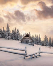 Fantastic Winter Landscape With Wooden House In Snowy Mountains. Christmas Holiday Concept. Carpathians Mountain, Ukraine, Europe