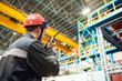 © Kadmy - industrial worker on factory with walkie talkie transmitter