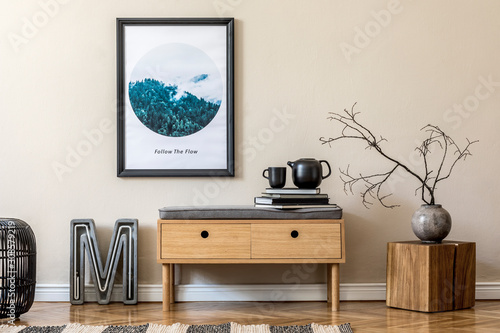 Plakat Design scandinavian home interior of living room with wooden commode, modern neon, rattan pouf, vase with flowers, tea pot and elegant accessories. Stylish home decor. Template. Mock up poster frame.