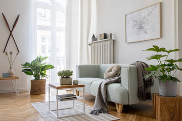 stylish scandinavian living room with design mint sofa, furnitures, mock up poster map, plants and e