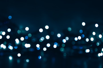 Dark background with blurred bokeh lights