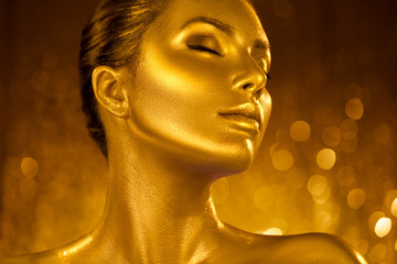 Wall Mural - golden skin make-up, woman face portrait closeup. model girl with holiday golden glamour shiny profe