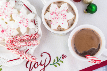 Wall Mural - Mugs of hot chocolate and variety of toppings for hot chocolate.