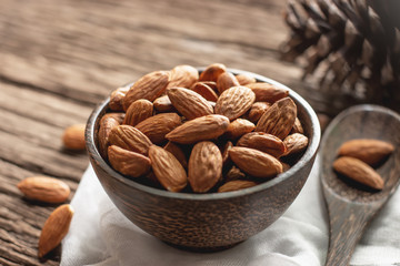 Bake almonds in a wooden bowl.