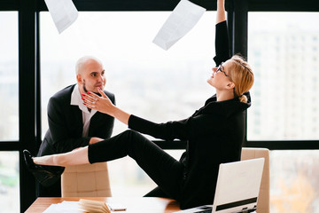 Success. Businesswoman throwing papers celebrating successful completion of negotiations