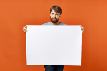 Wall Mural - man holding blank board