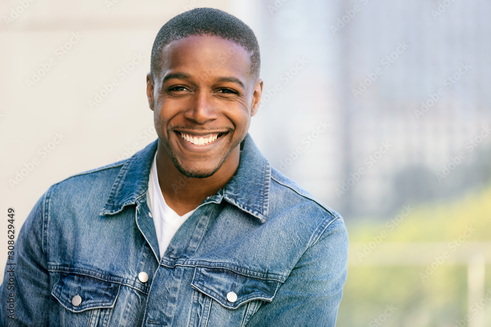 Close up head shot of a handsome commercial african american model with perfect white teeth smile after dentist, dental and orthodontic advertisement - obrazy, fototapety, plakaty 