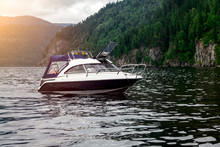 A Small Pleasure Boat With A Motor For Excursions And Relaxation In Picturesque Places On The Water And Traveling On A River Or Lake With Tourists. Voyage, Fishing And Tourism.