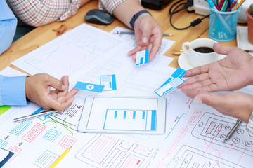 Wall Mural - graphic designers work together with ux ui designer planning application template layout framework f